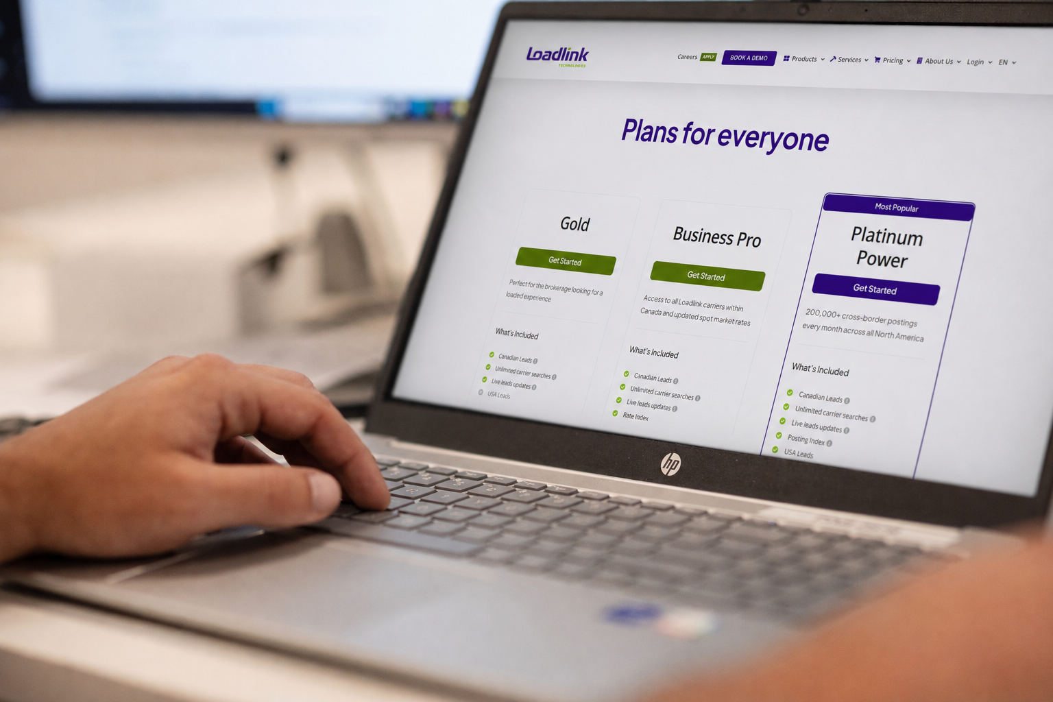 Close-up of a laptop displaying Loadlink’s broker plans.
